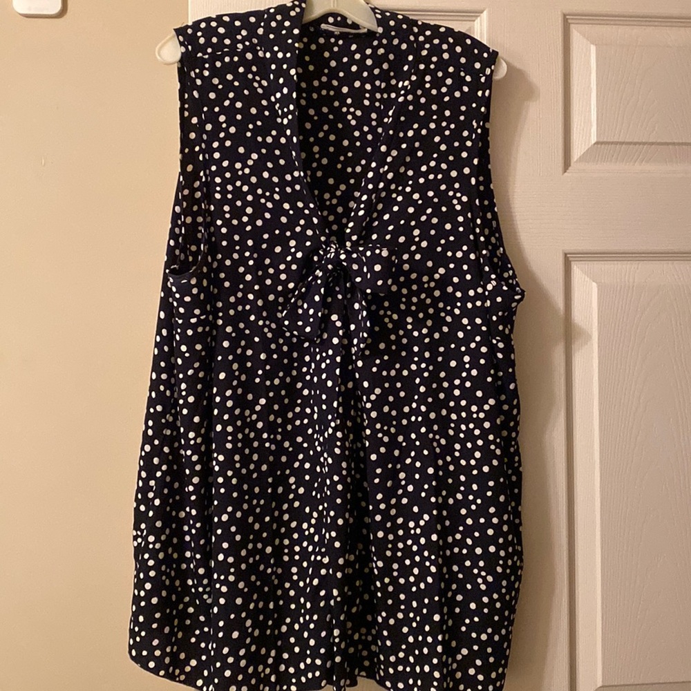Navy blue & cream sleeveless blouse.